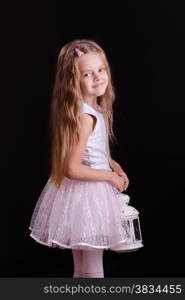 Five year old girl standing with a candlestick