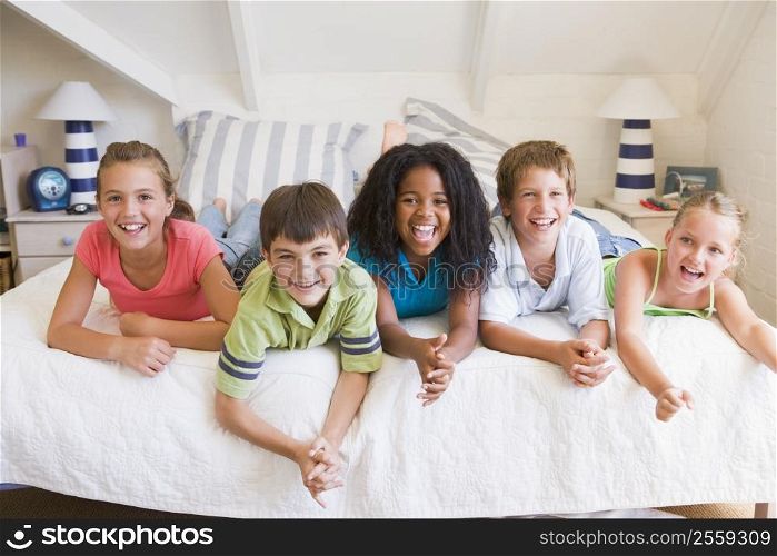 Five Young Friends Lying Down Next To Each Other