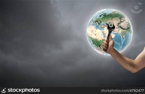 Fixing planet problem. Close up of hand spinning nut on Earth planet. Elements of this image are furnished by NASA