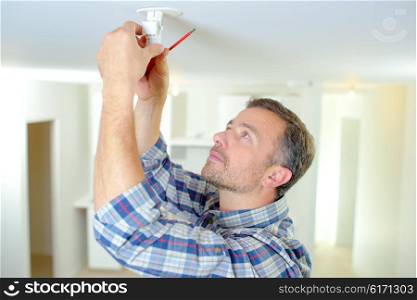 Fixing smoke alarm to the ceiling