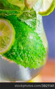fizzy cold mojito cocktail in a glass closeup