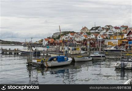 Fjallbacka,Sweden,03-08-2017: people and boats in the harbor of fjallbacka ,this is the touristic hotspot landmark in south sweden. fjallbacka village in sweden