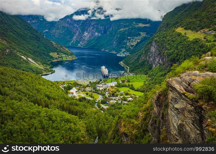 Fjord Geirangerfjord with cruise ship, view from Flydalsjuvet viewing point, Norway. Travel destination. Cruise ship on fjord, Geiranger village Norway.