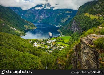 Fjord Geirangerfjord with cruise ship, view from Flydalsjuvet viewing point, Norway. Travel destination. Cruise ship on fjord, Geiranger village Norway.