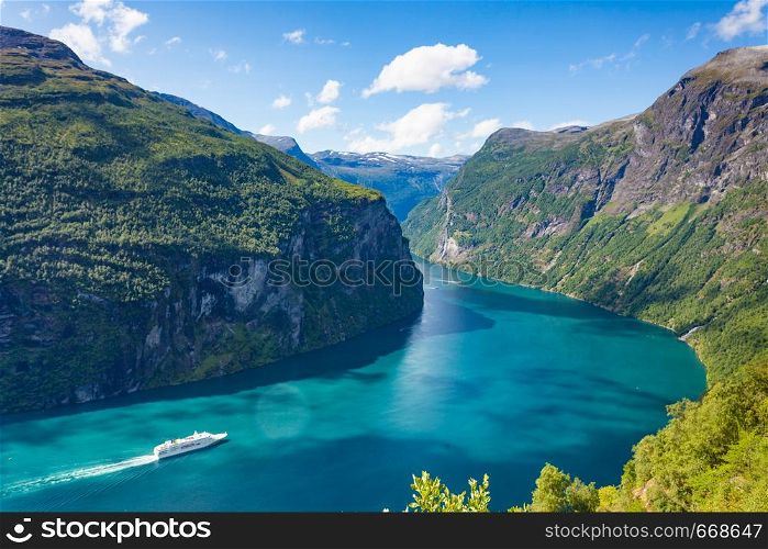Fjord Geirangerfjord with cruise ship, view from Ornesvingen viewing point, Norway. Travel destination. Fjord Geirangerfjord with cruise ship, Norway.