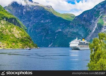 Fjord Geirangerfjord with ferry boat, Norway. Travel cruising.. Ferry boat on fjord in Norway.
