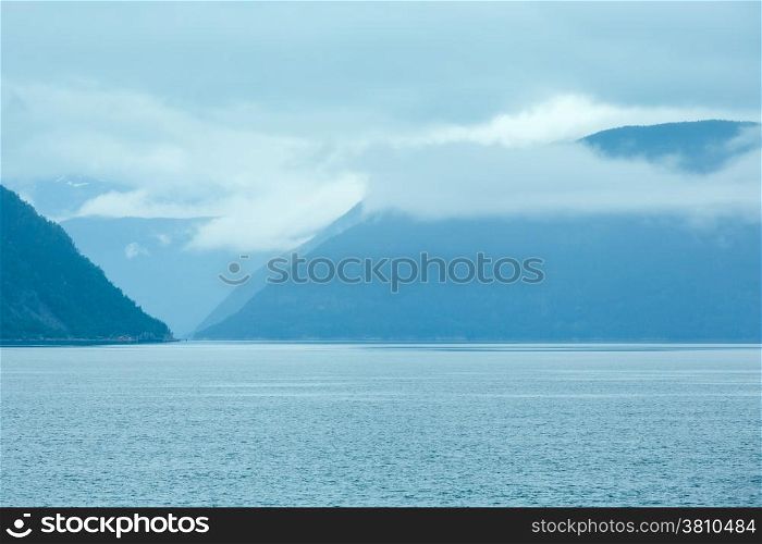 Fjord summer cloudy view from ferry (Norway)