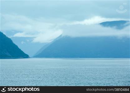 Fjord summer cloudy view from ferry (Norway)