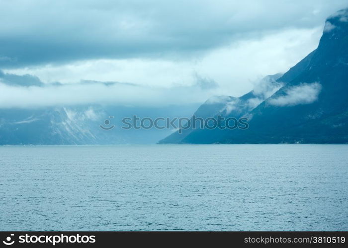 Fjord summer cloudy view from ferry (Norway)