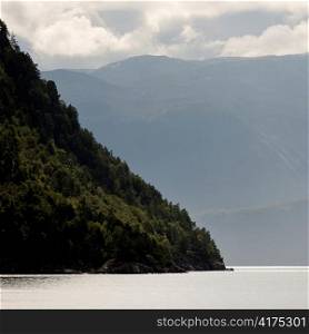 Fjord with mountain range in the background, Sognefjord, Norway
