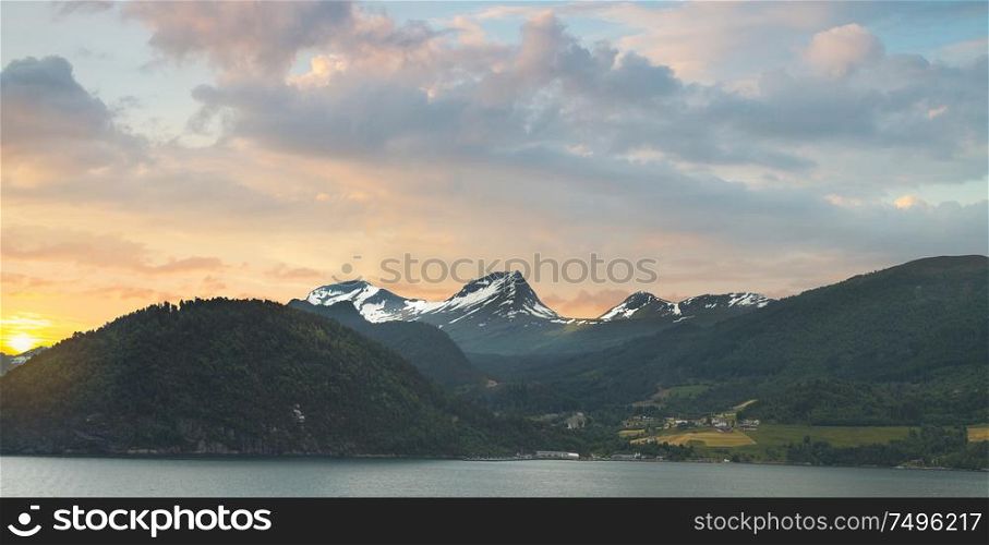 fjords dawn. the sun rises over the northern mountains