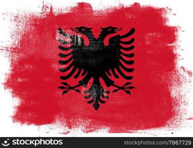 Flag of Albania painted with brush on solid background,