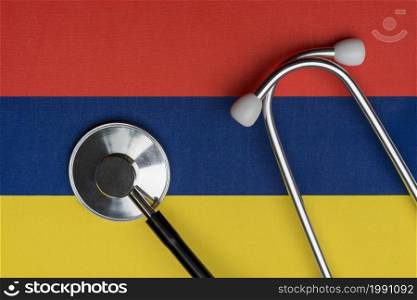Flag of Armenia and stethoscope. The concept of medicine. Stethoscope on the flag as a background.. Flag of Armenia and stethoscope. The concept of medicine.