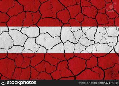 Flag of Austria over cracked background, conceptual image of crisis