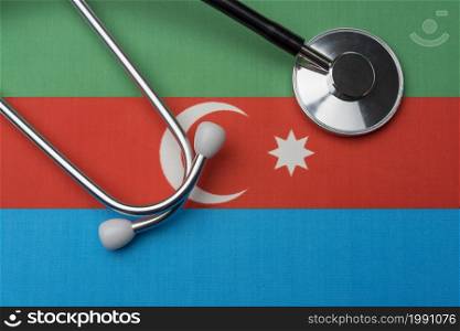Flag of Azerbaijan and stethoscope. The concept of medicine. Stethoscope on the flag as a background.. Flag of Azerbaijan and stethoscope. The concept of medicine.