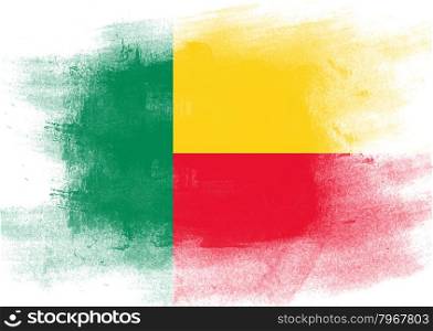 Flag of Benin painted with brush on solid background,