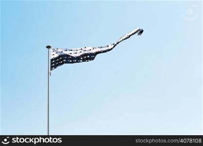 flag of Brittany in departement of Loire-Atlantique, France with blue sky background