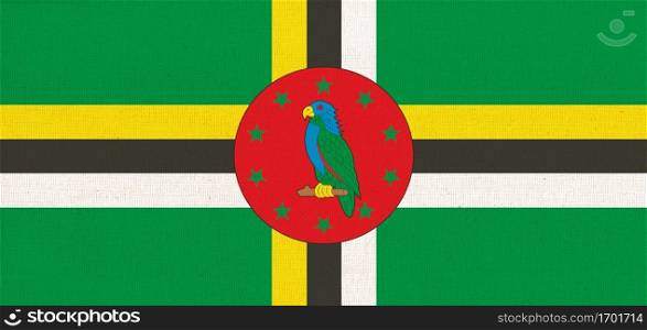 flag of Dominica. National Dominica flag on fabric surface. national flag on textured background. Fabric Texture. Republic of Dominica. National Dominica flag on fabric surface. Fabric Texture