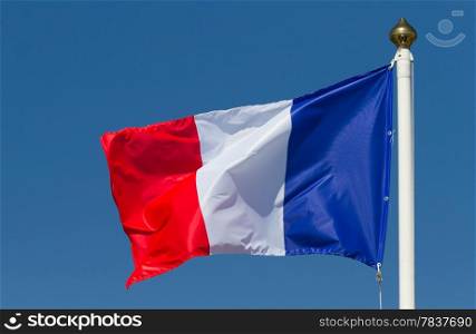 Flag of France on the blue sky