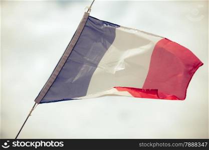 Flag of France waving in the breeze sky background