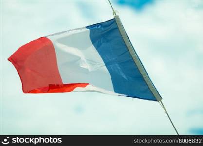 Flag of France waving in the breeze sky background