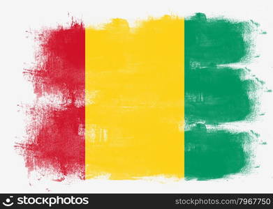 Flag of Guinea painted with brush on solid background,