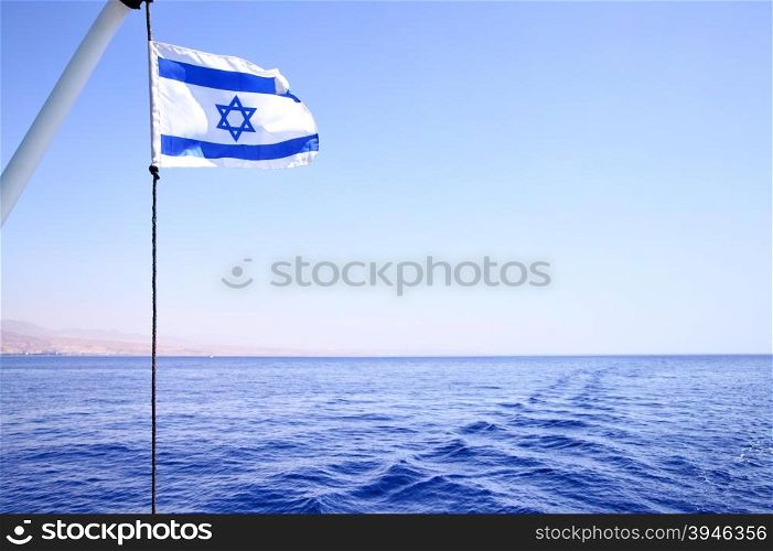 Flag of Israel on the wind, Red sea in the background