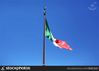 flag of Italy on a blue sky background. flag of Italy on a blue sky background. symbol of italy