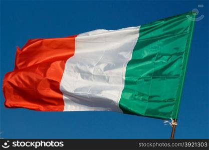 Flag of Italy with wrinkles and seams expanded in the breeze