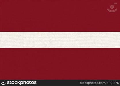 Flag of Latvia. Latvian state symbol. flag on fabric surface. Fabric Texture. Latvian state symbolstate symbol. Republic of Latvia. Flag of Latvia. Latvian state symbol. Fabric Texture