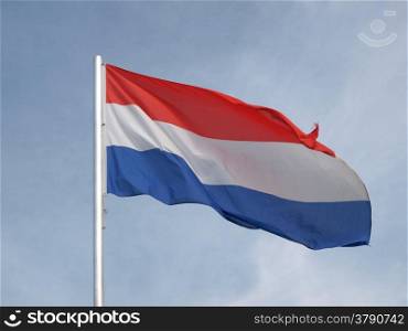 Flag of Netherlands. Flag of Netherlands over a blue sky