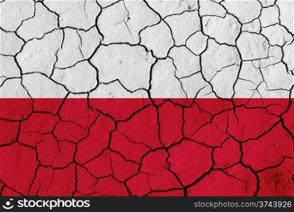 Flag of Poland over cracked background, conceptual image of crisis