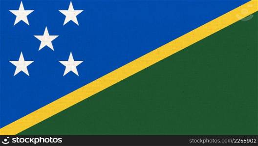 Flag of Solomon Islands. Solomon Islands flag on fabric surface. Fabric Texture. National symbol. Country in Oceania. Flag of Solomon Islands. Fabric Texture. National symbol. Country in Oceania