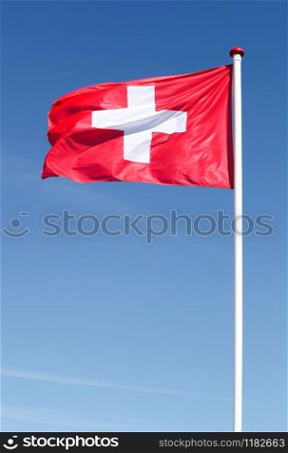 Flag of Switzerland waving in the sky
