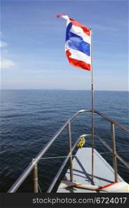 Flag of Thailand on the white boat