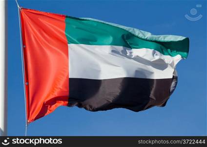 Flag of United Arab Emirates on the blue sky