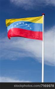Flag of Venezuela waving in the sky