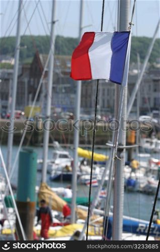 Flag on boat in harbour