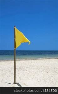 Flag on the beach, Cancun, Mexico