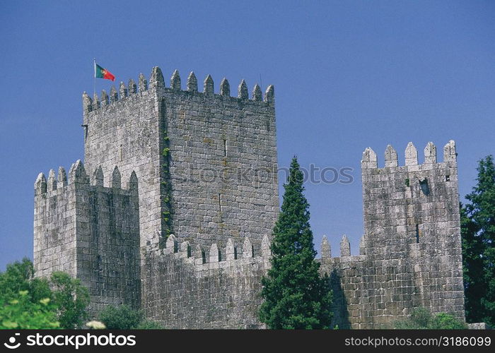 Flag on the top of a castle, Dukes of Braganca Palace, Guimaraes, Minho, Portugal