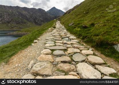 Flagged path Miners track to summit of Snowdon. Snowdonia, Wales, United Kingdom.