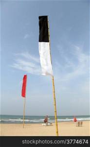 Flags and table on the Bentota beach, Sri Lanka