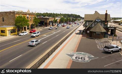 Flagstaff, Arizona/USA- August 28, 2019: Traffic makes it&rsquo;s way past the train station along route 66 in Flagstaff, Arizona USA 2019