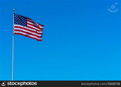 Flagstaff of United state of America on blue sky background,