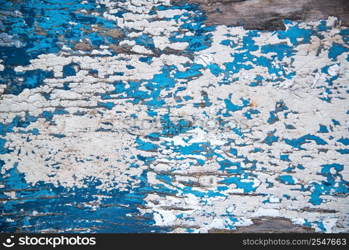 Flaking paint texture on wooden background