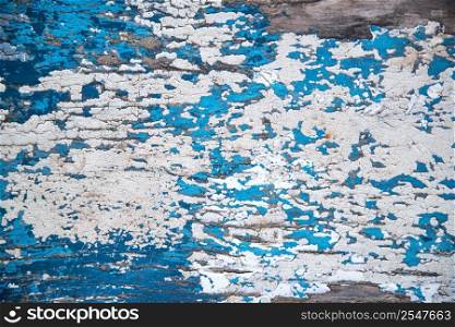 Flaking paint texture on wooden background