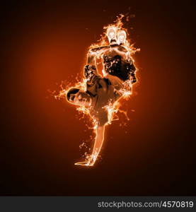 Flame and fire dancer against black background