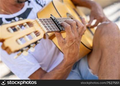 Flamenco musician playing Spanish guitar in Albaicin, Granada, Spain. Flamenco musician playing Spanish guitar in Granada..