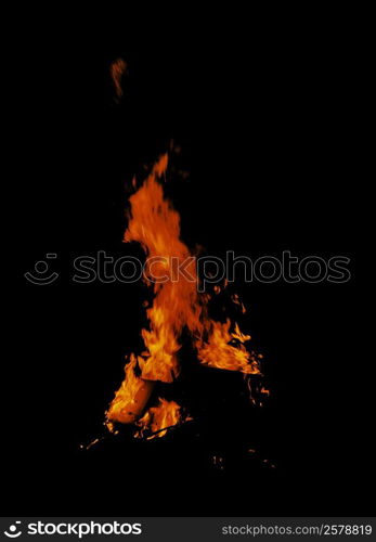 Flames of a fire at night