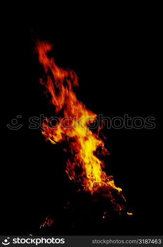 Flames of a fire at night